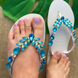 White women slippers decorated with wonderful blue stones