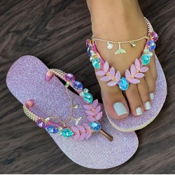 Mauve women slippers decorated with stones and metal