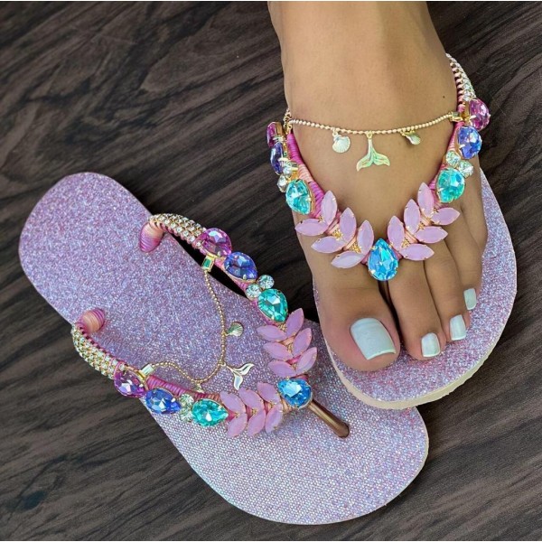 Mauve women slippers decorated with stones and metal